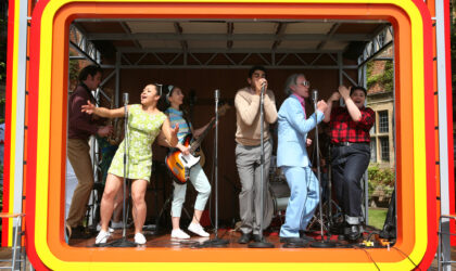 Talking to Your Customers People singing on stage