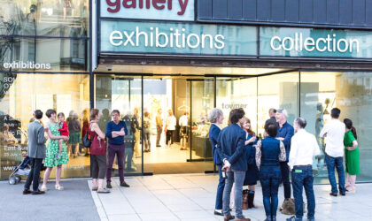Image of people standing outside an art gallery