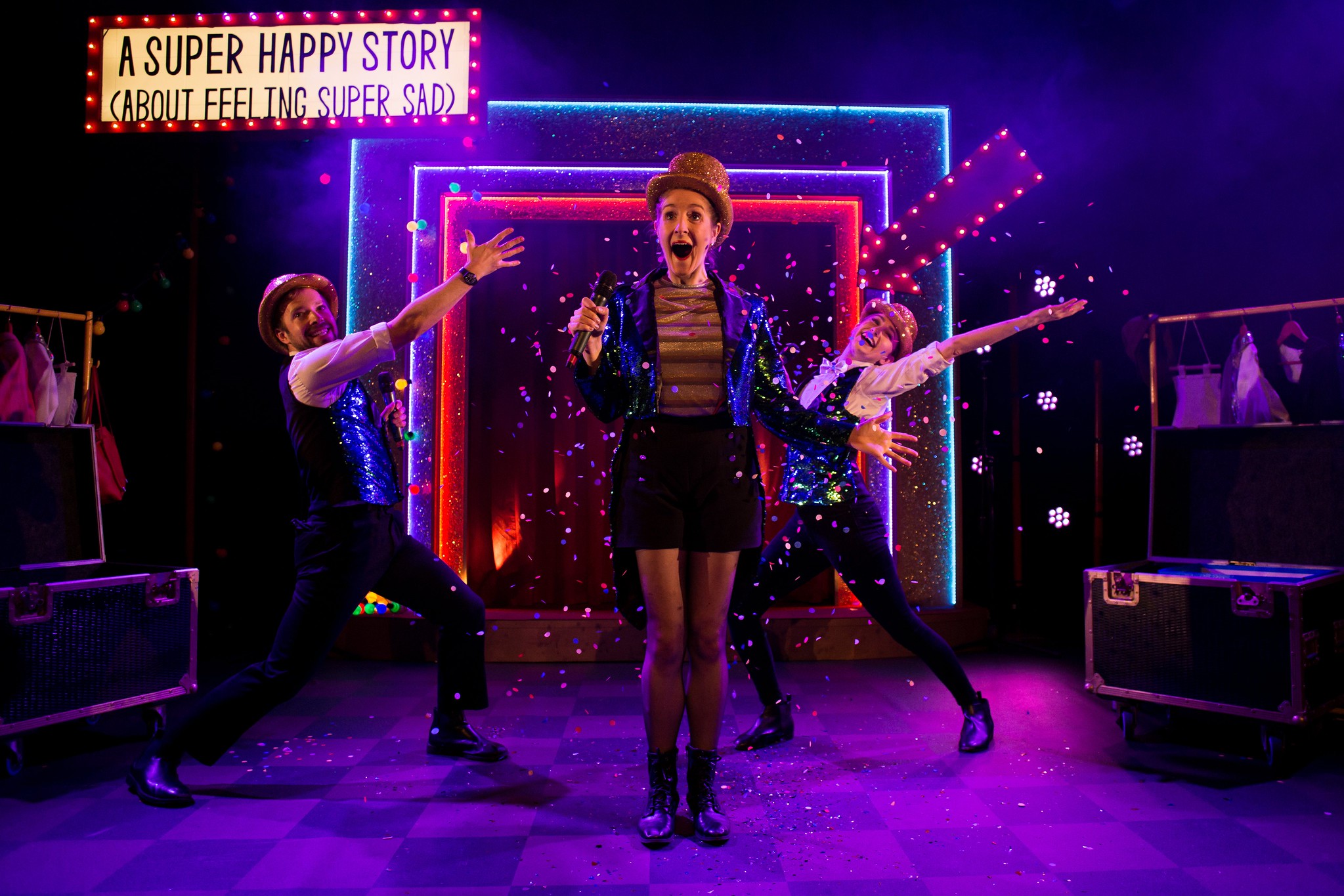 Performers acting on theatre stage