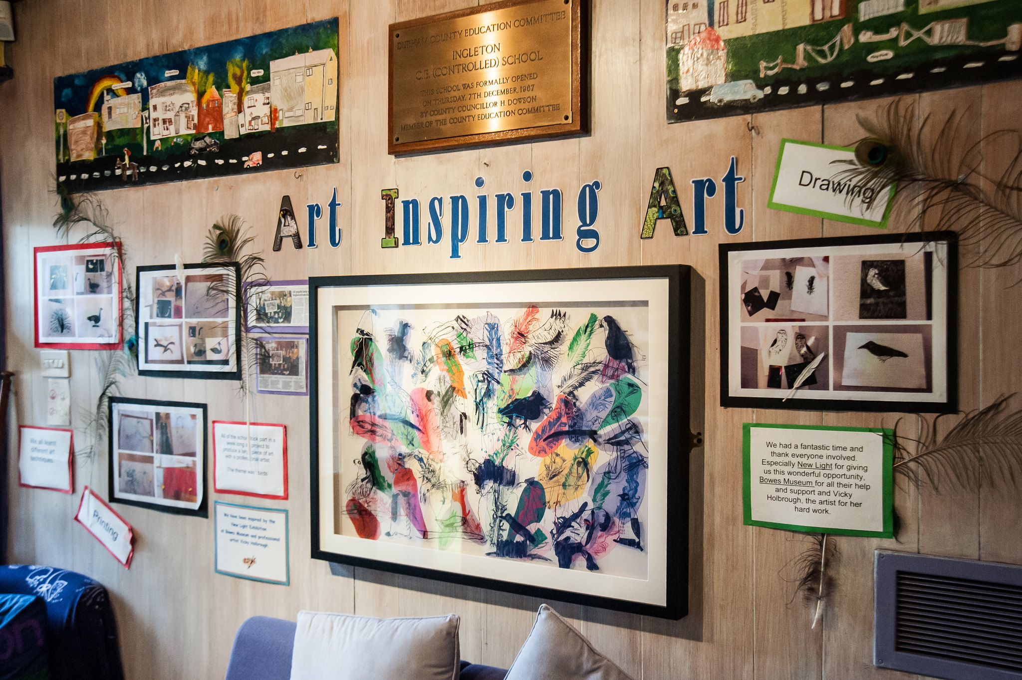 Image of different pieces of art on a wall