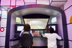 Two people driving a virtual train