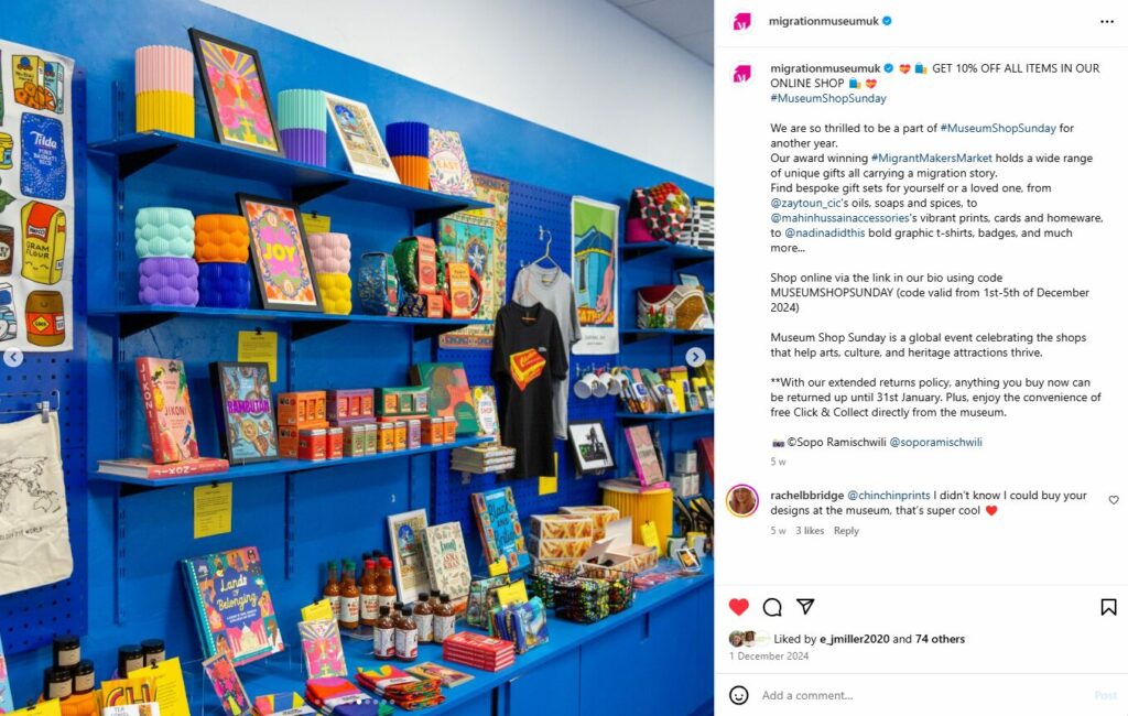 A blue shop wall with different colorful items, such as book, mugs deployed on it.