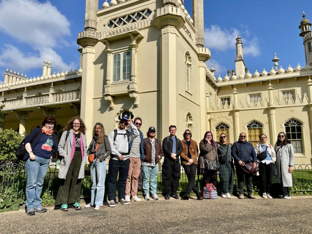 Some of the Digital Culture Network team standing in a row outside the Brighton Pavillion.